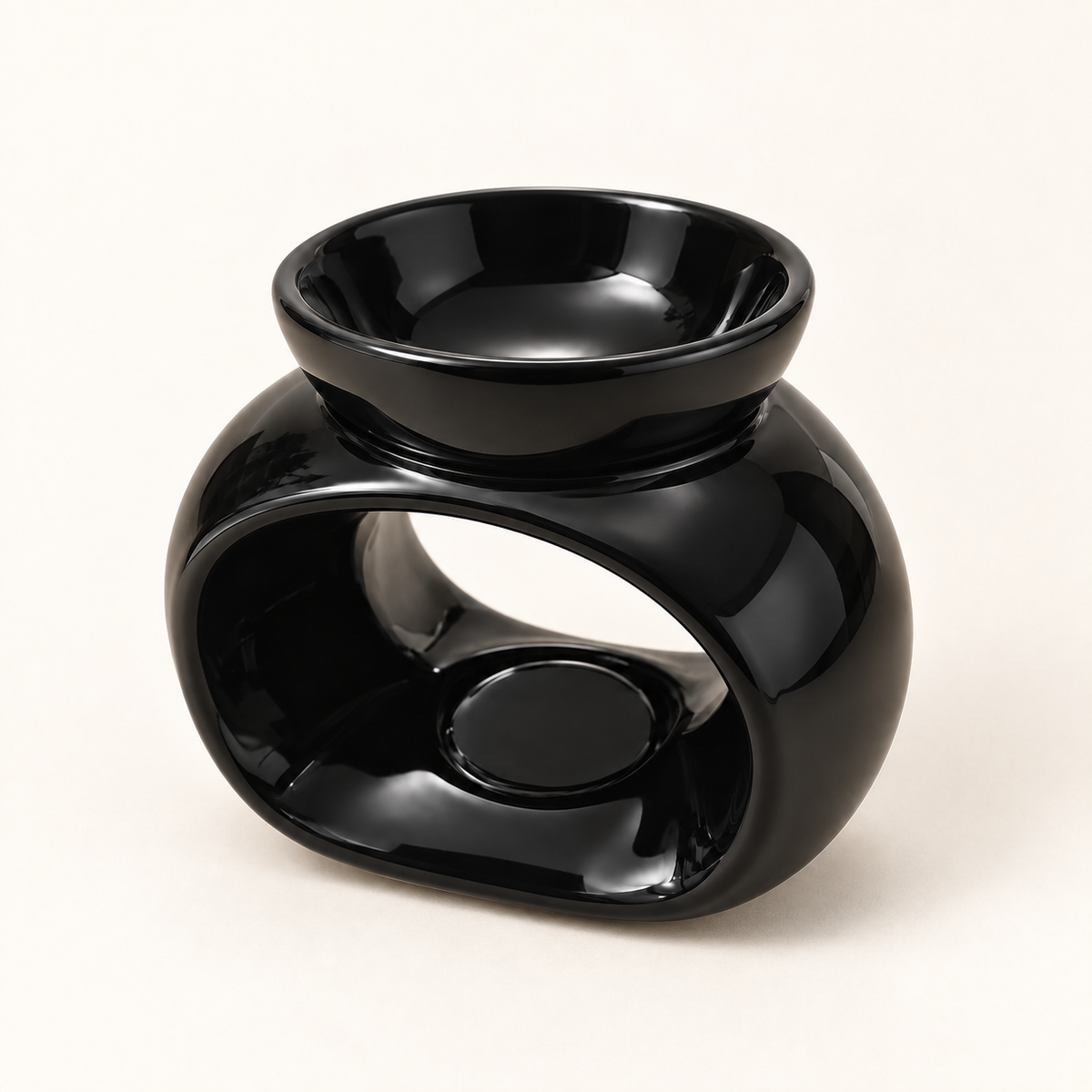 Glossy black oval ceramic wax melt burner shown from the opposite three-quarter angle.