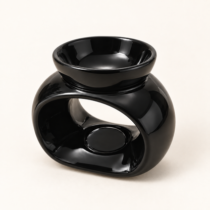 Glossy black oval ceramic wax melt burner shown from the opposite three-quarter angle.